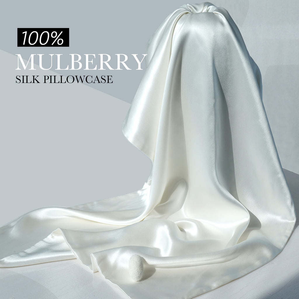 Draped ivory white mulberry silk fabric with a lustrous sheen — 100% pure mulberry silk.