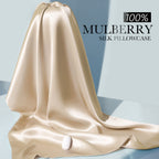 Draped beige mulberry silk fabric with a lustrous sheen — 100% pure mulberry silk.