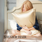 Woman hugging a beige silk pillowcase — softer skin, shinier hair, better sleep.